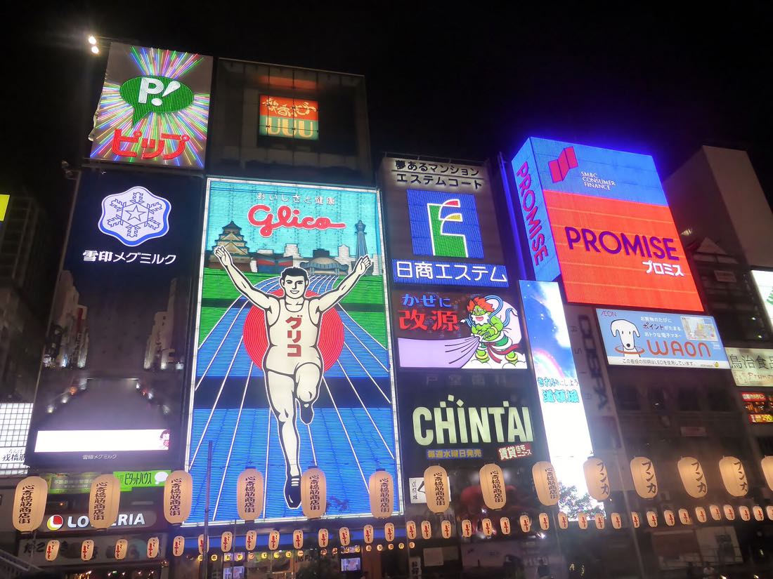 Neon signs and the Glico man over the Dotonbori canal at night